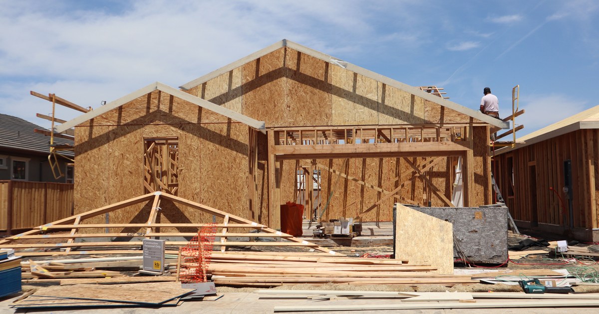New home under construction with exposed wood framing